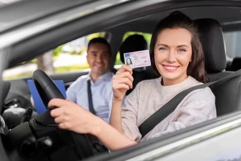 Car driving instructor and driver with license Stock Photos
