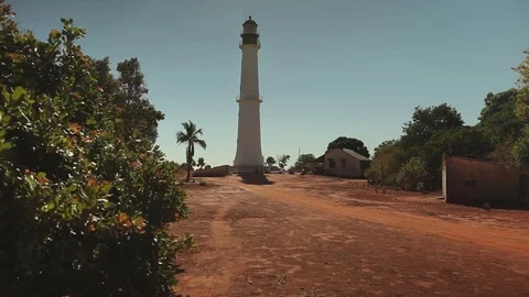 A car driving to a lighthouse Stock Footage 73660920
