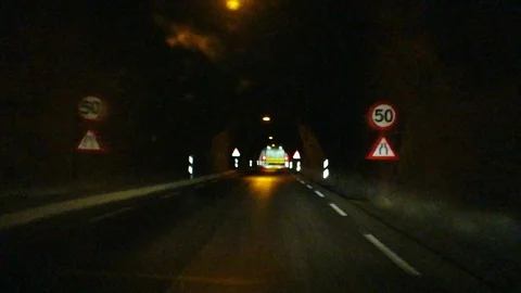 Car driving in a long tunnel stopping fo... | Stock Video | Pond5