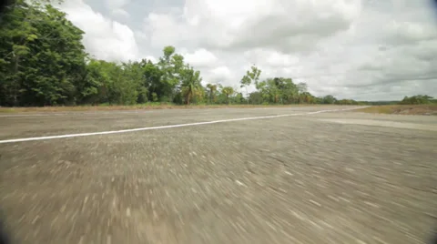 CAR DRIVING - LOW ANGLE WHEEL SHOT Stock Footage 29893340