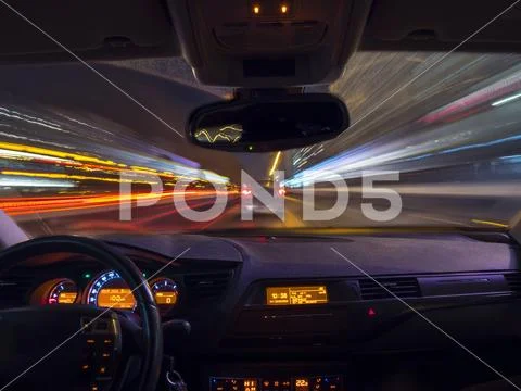 A car driving on a motorway at high speeds Stock Photos