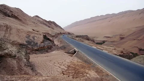 Car driving on mountain road Stock Footage 235106779