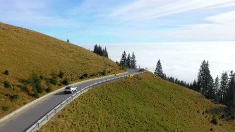 Car driving on the mountain road with forest. 4K aerial footage. Stock-Footage 236203452
