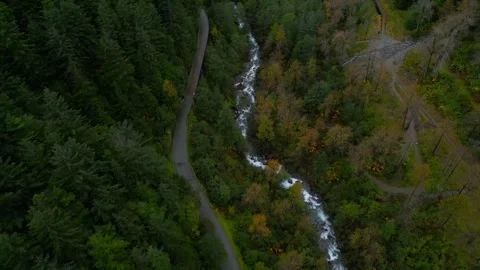 Car driving on a mountain road next to river Stock Footage 294710361
