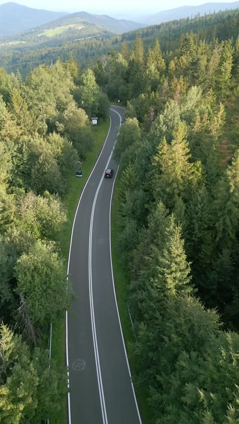 Car driving a mountain road in summer. Stock Footage 248503857