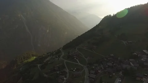 Car driving on a mountain road in the sunset, Verbier, Switzerland Video stock 101580337