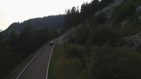 Car driving on a mountain road in the sunset, Verbier, Switzerland Video stock 101580347