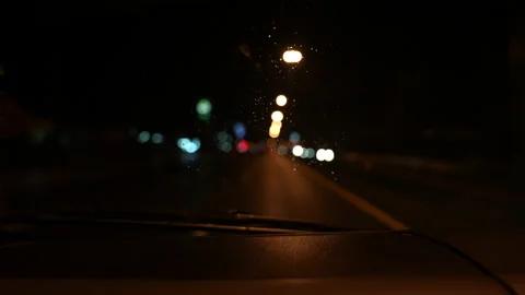 Car driving on night of slow motion video  Vídeos de archivo 221608980