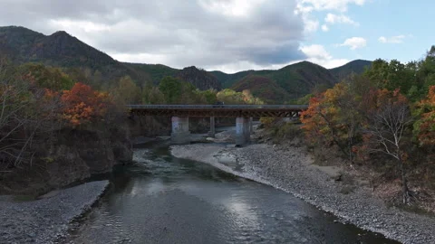 The car is driving over a bridge in the mountains Stock Footage 266920100