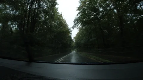 Car is driving in the rain Stock Footage 95721541