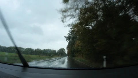 Car is driving in the rain Stock Footage 95721592