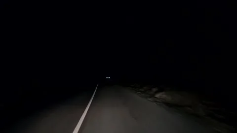 Car driving on the road at night Stock Footage 163244643