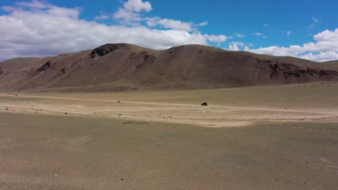 Car driving off-road through desert, mountain landscape, adventure travel Stock Footage 222015432
