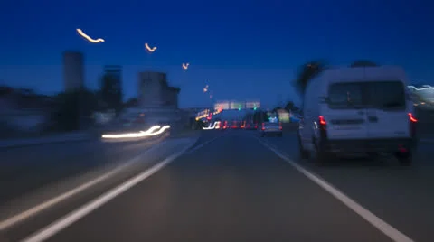 Car driving Rush-hour Traffic in city time lapse night Stockbeeldmateriaal 24951609