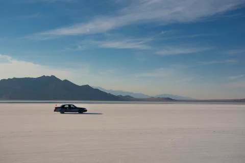 Car driving on Salt Flats Stock Illustration