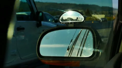 Car Driving - Side Mirror - 02 - Highway Traffic and Sun Stock Footage 53778283