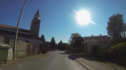 Car driving in a small town Stock Footage 49891820