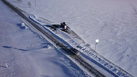 Car driving on a snow-covered road Stock Footage 282345342