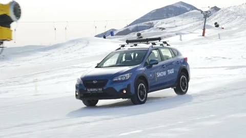 Car driving on snow hill down rolling shoot Stock Footage 236423015