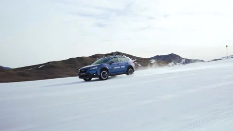 Car Driving on snow rolling shoot Stock Footage 236422992