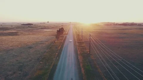 Car driving into Sunset (drone) Video stock 284045330