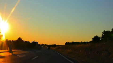 Car driving at sunset ProRes Stock Footage 26342791