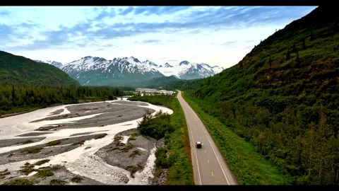 Car driving through an Alaskan glacier valley on a mountain road Stock-Footage 341329271