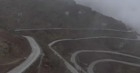 Car Driving Through Cloudy and Curvy Mountain Road Stock Footage 141180523