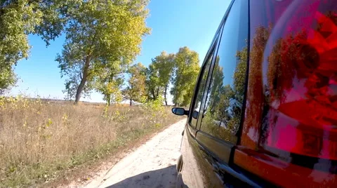 Car driving through the countryside. The camera is left outside. Stock Footage 44785561