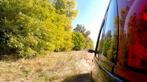 Car driving through the countryside. The camera is left outside. Stock Footage 44827505