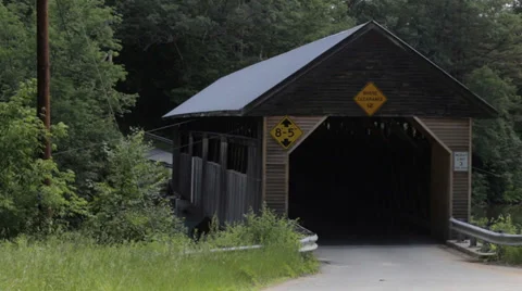Car driving through covered bridge Stock Footage 39634621