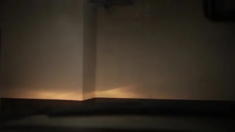 The car is driving through a dark underground parking Stock Footage 153849081