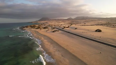 Car driving through desert dunes of Corralejo. Tourism in Fuerteventura, Canary Stock Footage 346415535