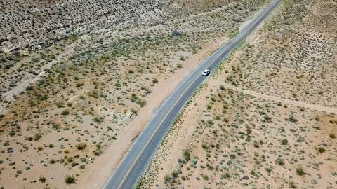 Car driving through desert outside Las Vegas, Nevada, USA in 4K Stockbeeldmateriaal 90361919