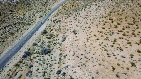 Car driving through desert outside Las Vegas, Nevada, USA in 4K Stockbeeldmateriaal 90361926