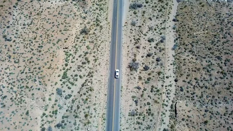 Car driving through desert outside Las Vegas, Nevada, USA in 4K Stockbeeldmateriaal 90361940