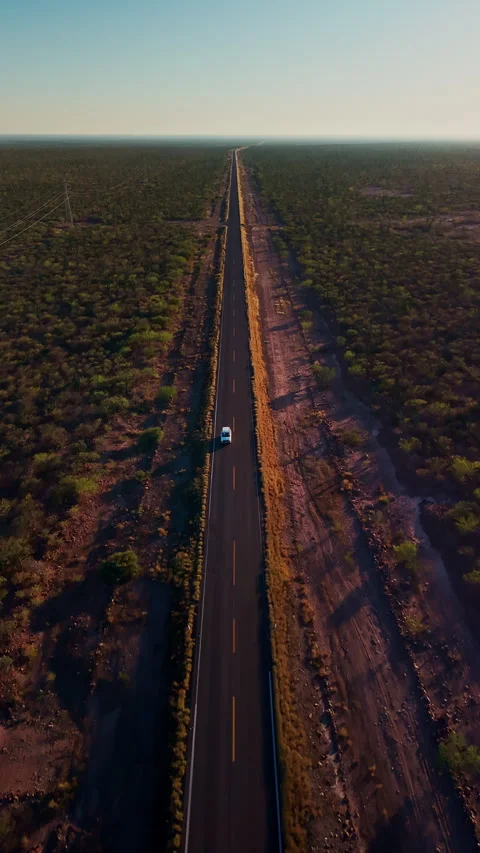 Car driving through desertic road Stock Footage 340982736