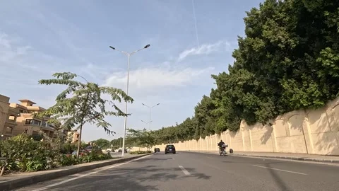 Car Driving Through Developed District Streets New Cairo Showing Buildings Vidéo 329761993