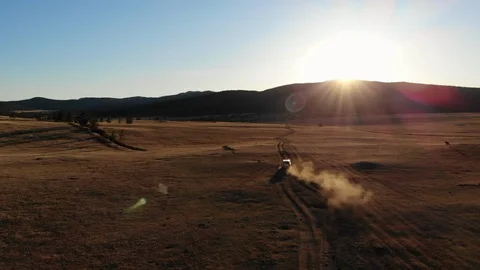 Car Driving Through the Field During Sunset – Aerial Footage 스톡 동영상 114067295