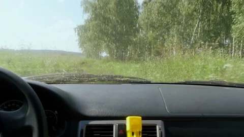 Car is driving through the field Stock Footage