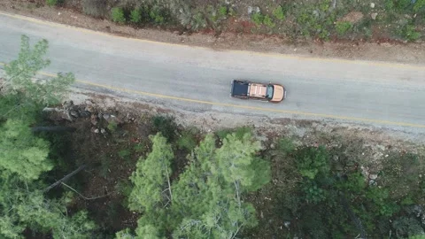 Car Driving Through The Forest And The Lake On The Side. Beautiful Mountain Road Stock Footage 228828257