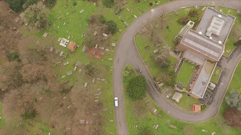 Car driving through graveyard. Ascending. Stock Footage 180556143