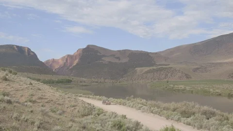 Car Driving Through Green River Canyon Landscape Stock Footage 121590451