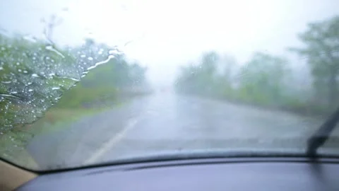 Car Driving Through Heavy Rain on Blurred Highway Video stock 305956530