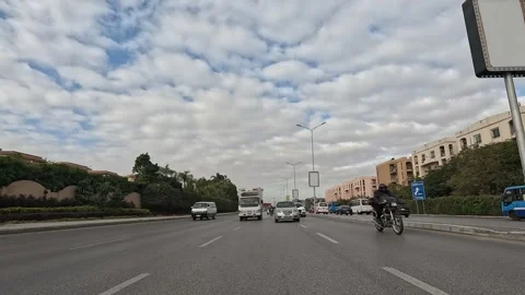 Car Driving Through Large Roads New Cairo Showing Buildings Traffic And Urban Vídeo Stock 329700972