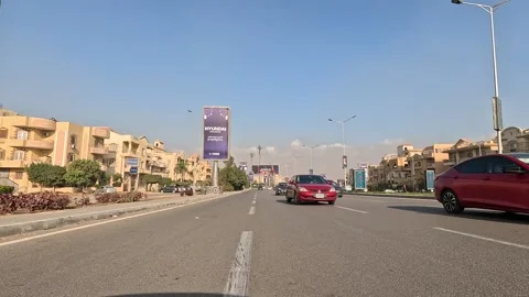 Car Driving Through Large Roads New Cairo Showing Buildings Traffic And Urban Stock Footage 329868037