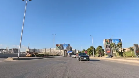 Car Driving Through Modern Residential District New Cairo Showing Buildings Stock Footage 329672841