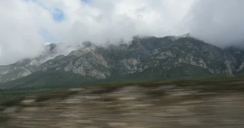 Car driving through mountainous terrain Stock Footage 86473858