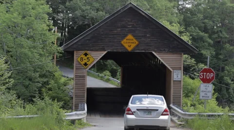 Car driving through old covered bridge Stock Footage 39634252