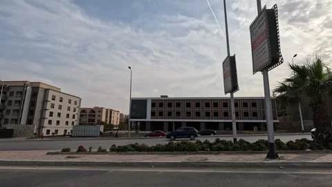 Car Driving Through Quiet District Streets New Cairo Showing Buildings Traffic Vídeo Stock 329774024